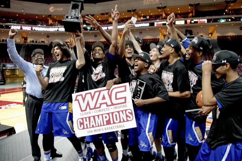 The Cal State Bakersfield's basketball team celebrates after beating New Mexico State, 57-54, in the Western Athletics Conference championship game on March 12.