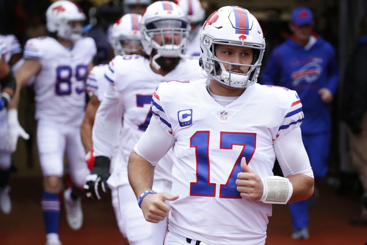 Buffalo Bills quarterback Josh Allen (17) runs onto the field prior to an NFL football game against the Miami Dolphins, Sunday, Oct. 31, 2021, in Orchard Park, N.Y. (AP Photo/Jeffrey T. Barnes)