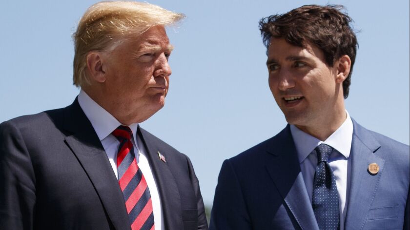 President Donald Trump talks with Prime Minister Justin Trudeau during a G-7 Summit welcome ceremony in Charlevoix, Canada. Canada enacted billions of dollars in retaliatory tariffs against the U.S. in response to the Trump administration's duties on Canadian steel and aluminum.