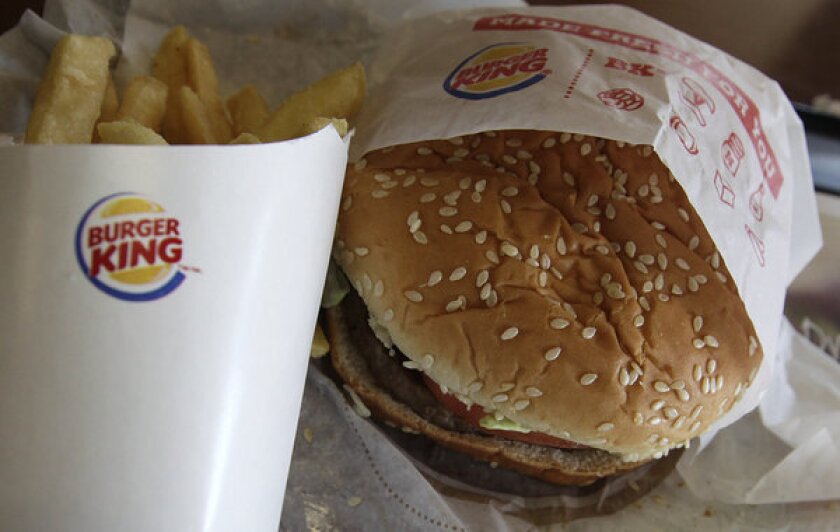 Burger King opened its first branch n France after withdrawing from the country 15 years ago.