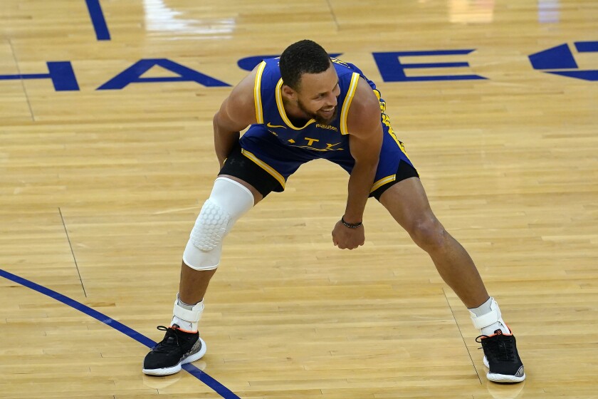 Golden State Warriors guard Stephen Curry smiles after shooting a 3-point basket during the second half of an NBA basketball game against the Utah Jazz in San Francisco, Monday, May 10, 2021. (AP Photo/Jeff Chiu)