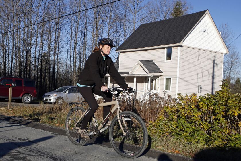 Nurse Kaci Hickox defies quarantine orders by leaving her home in Fort Kent, Maine, to take a bike ride with her boyfriend. State officials are going to court to keep Hickox in quarantine for the remainder of her 21-day incubation period for Ebola that ends on Nov. 10.