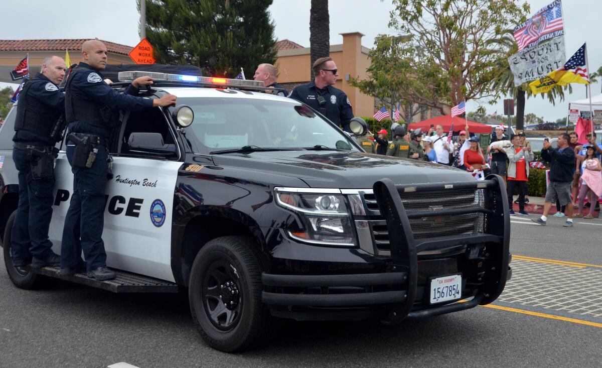 Huntington Beach police helped Newport Beach police as a huge crowd gathered to see Donald Trump.