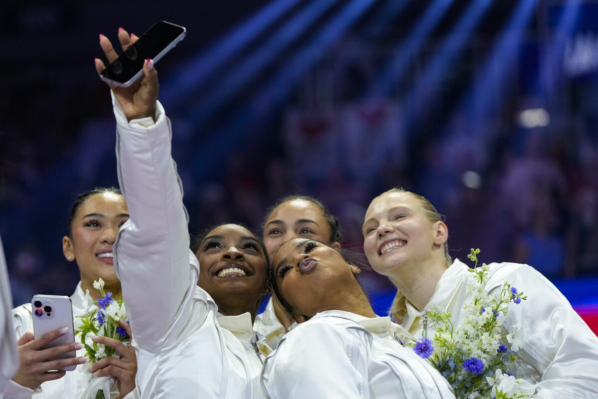 Simone Biles takes a selfie with Suni Lee, Hezly Rivera, Jordan Chiles and Jade Carey