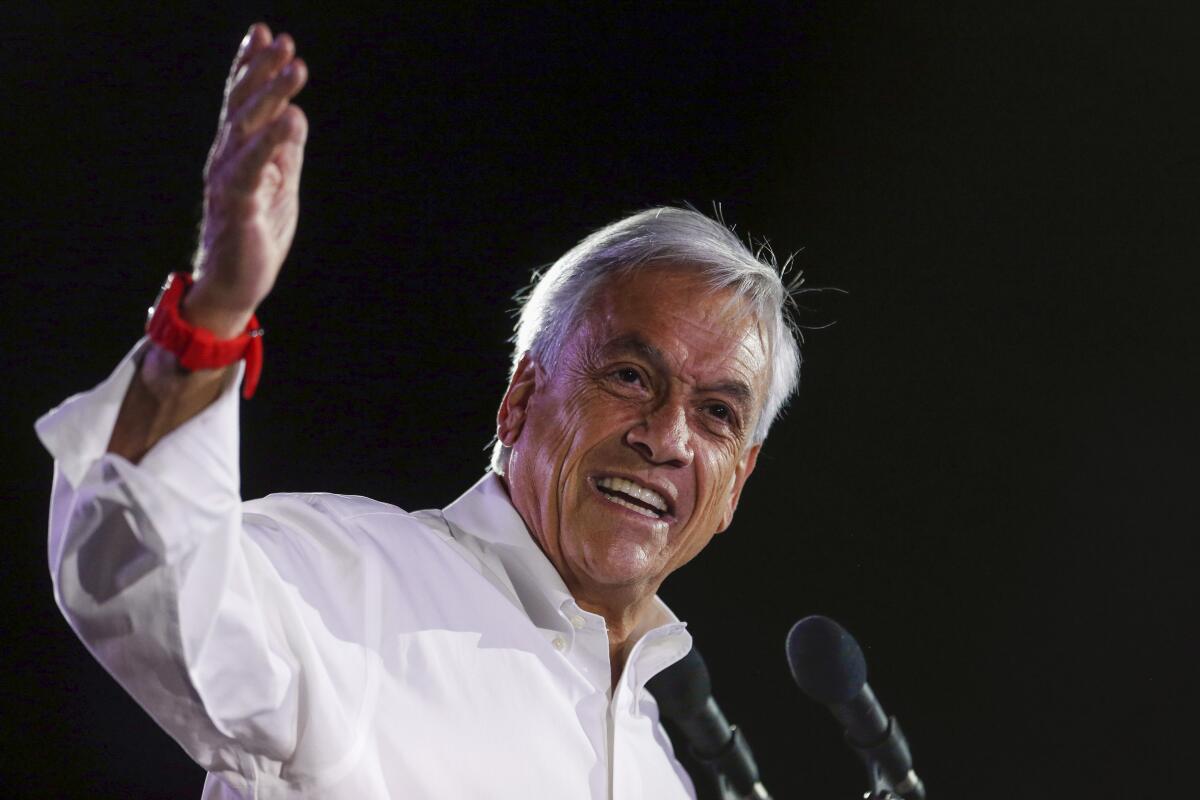 FILE - Sebastian Pinera, former Chilean president who is running again for office, addresses supporters at his closing campaign rally in Santiago, Chile, Nov. 16, 2017. Piera died on Tuesday, Feb. 6, 2024 in a helicopter crash in Lago Ranco, Chile, according to Chilean Interior Minister Carolina Toh who announced it on live TV. (AP Photo/Luis Hidalgo, File)