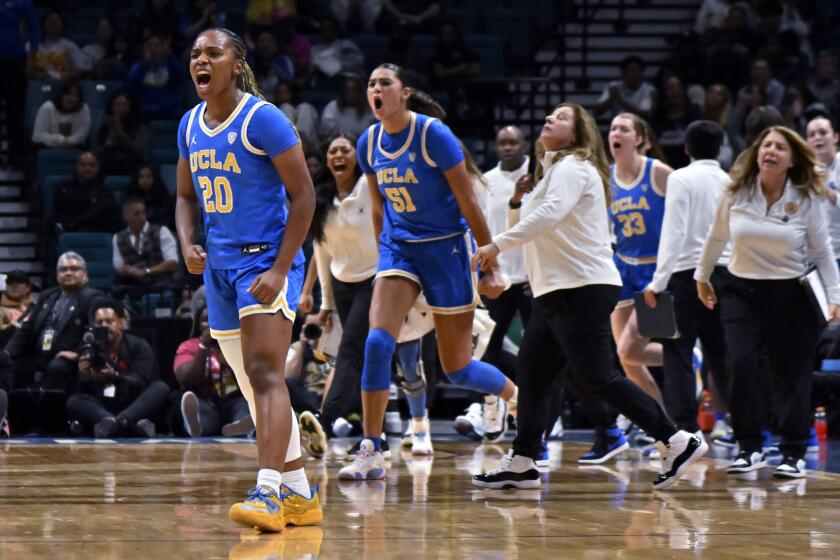 UCLA guard Charisma Osborne reacts after hitting a 3-point basket against USC during the Pac-12 tournament 