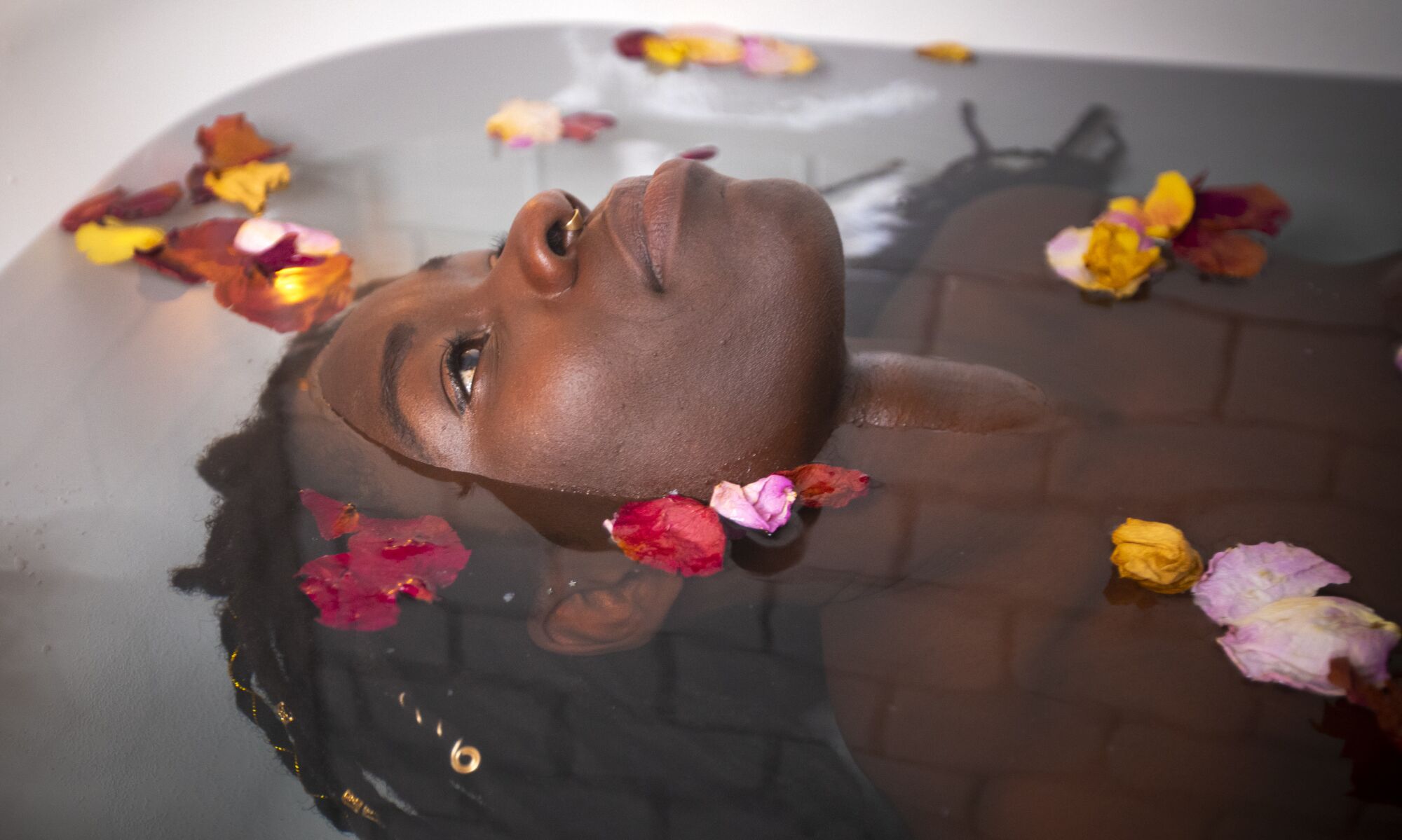 Alua Arthur takes a bath as a ritual, by soaking that includes candles, rose petals and epsom salt.