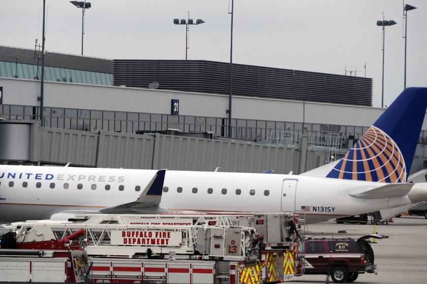 Emergency vehicles surround a SkyWest Airlines plane, operating as United Express, that made an emergency landing at Buffalo Niagara International Airport on Wednesday.