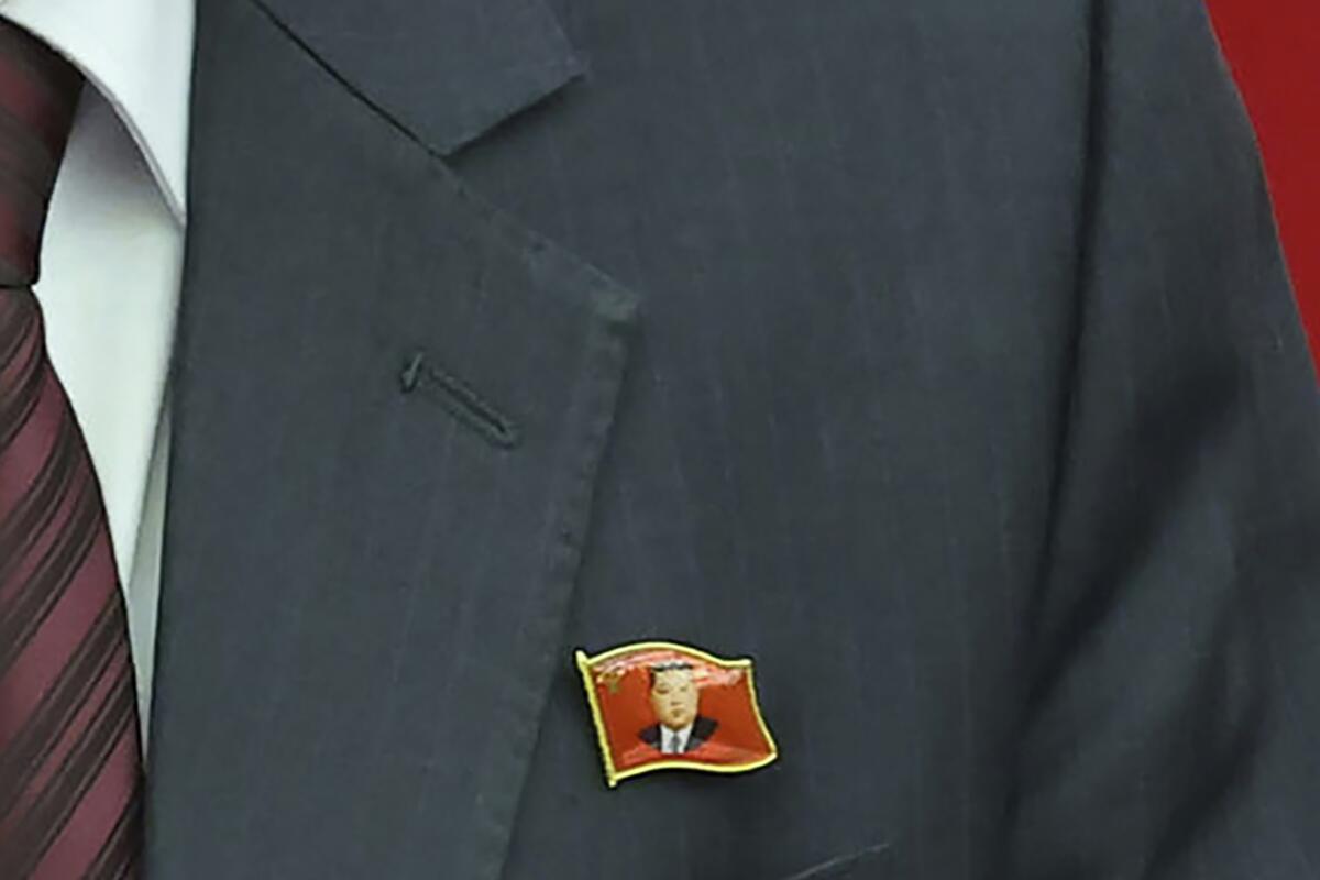 A pin with the image of Kim Jong Un.
