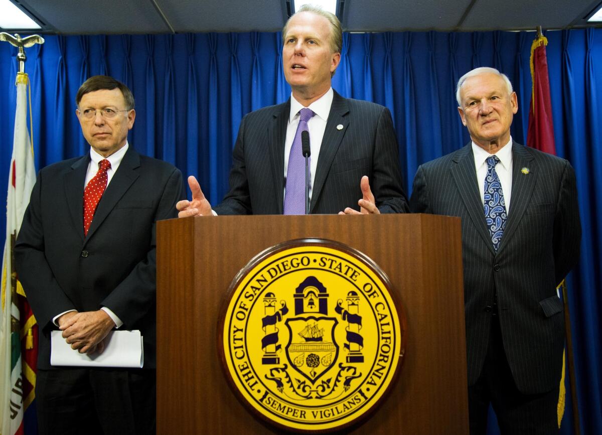 San Diego Mayor Kevin Faulconer, center, speaks in January. The Fair Political Practices Commission has received a complaint over a link to Faulconer’s re-election Facebook account.