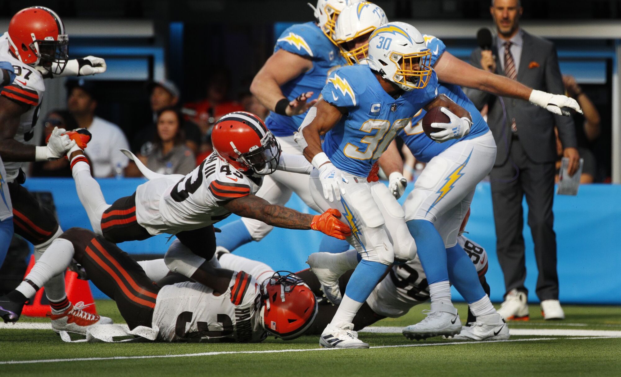 Chargers running back Austin Ekeler breaks free from the tackle attempt by Cleveland Browns free safety John Johnson.