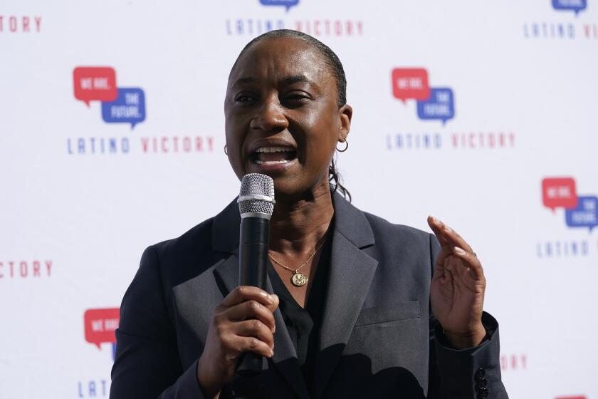 Laphonza Butler, president of EMILY'S List, speaks during a rally held by the Latino Victory Fund, Thursday, Oct. 20, 2022, in Coral Gables, Fla. The midterm elections are November 8. (AP Photo/Lynne Sladky)