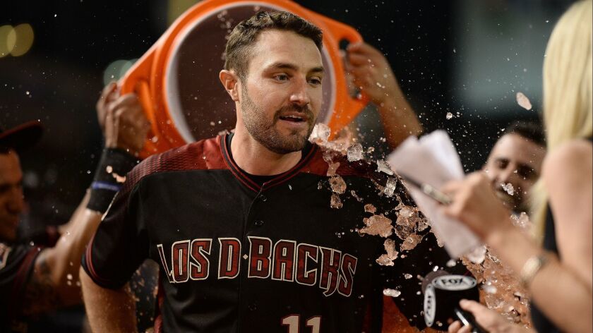Arizona's A.J. Pollock gets soaked by teammates after hitting a walkoff single against Houston on May 5, 2018.