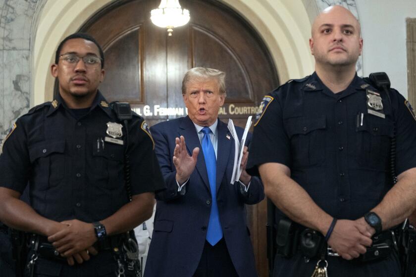 Former President Donald Trump speaks with journalists during a midday break from court proceedings in New York, Monday, Oct. 2, 2023, as he attends the start of a civil trial in a lawsuit that already has resulted in a judge ruling that he committed fraud in his business dealings. (AP Photo/Craig Ruttle)