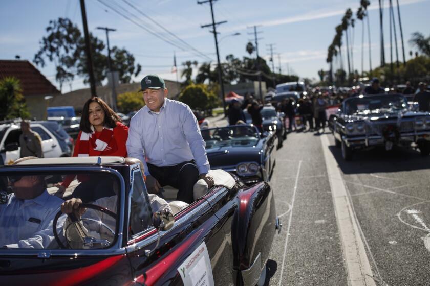 LOS ANGELES, CALIF. -- SUNDAY, DECEMBER 2, 2018: Sheriff-elect Alex Villanueva and his wife Vivian attend the East L.A. Christmas Parade, in Los Angeles, Calif., on Dec. 2, 2018. (Marcus Yam / Los Angeles Times)