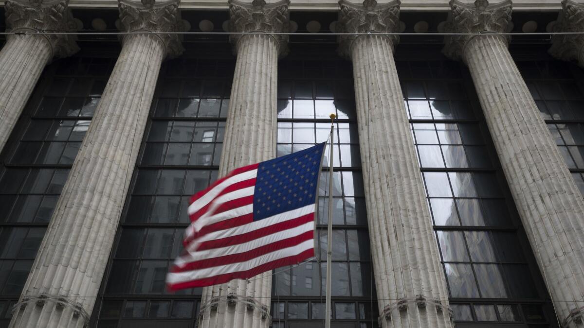 An American flag flies outside the New York Stock Exchange last month.