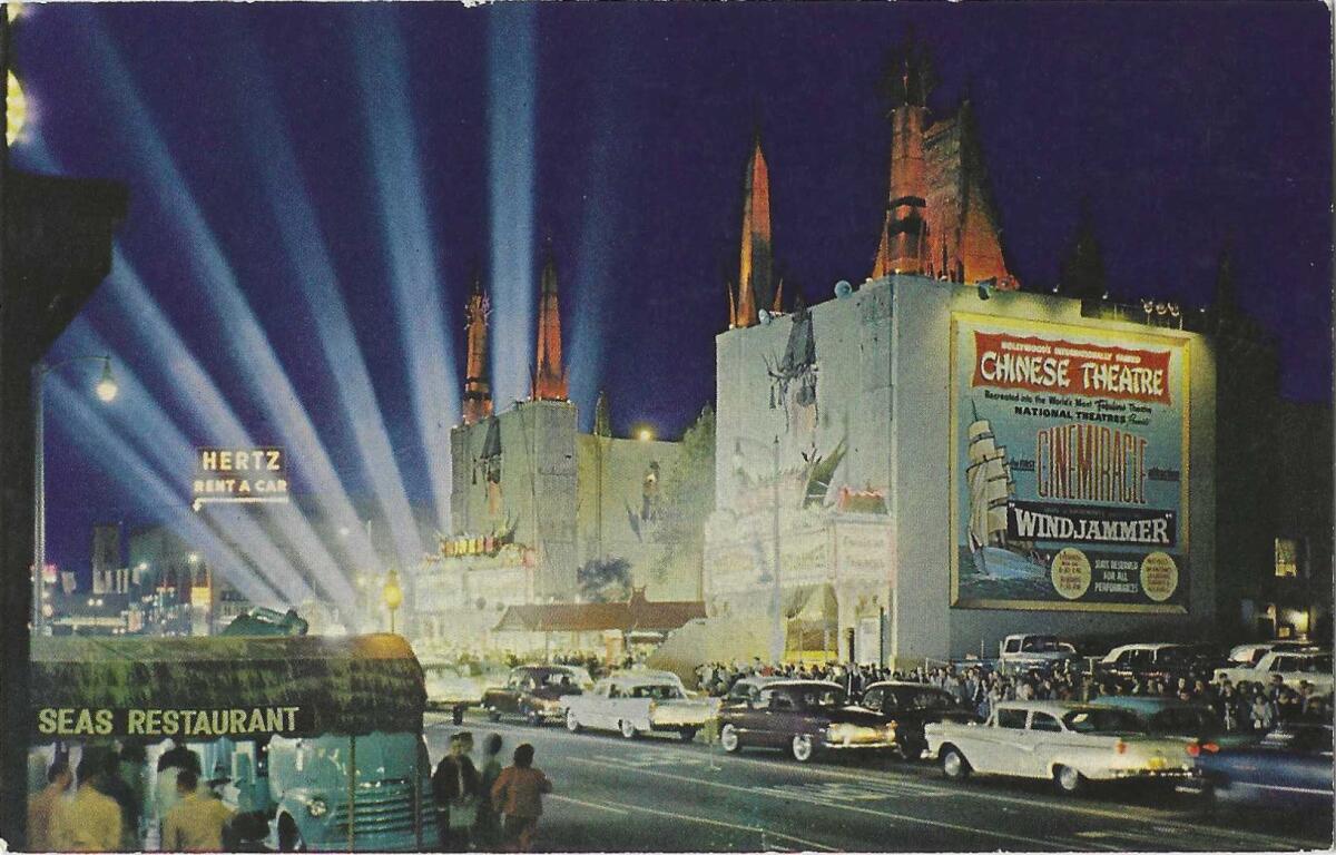 Searchlights illuminate the sky outside the Chinese Theatre in Hollywood on a vintage postcard