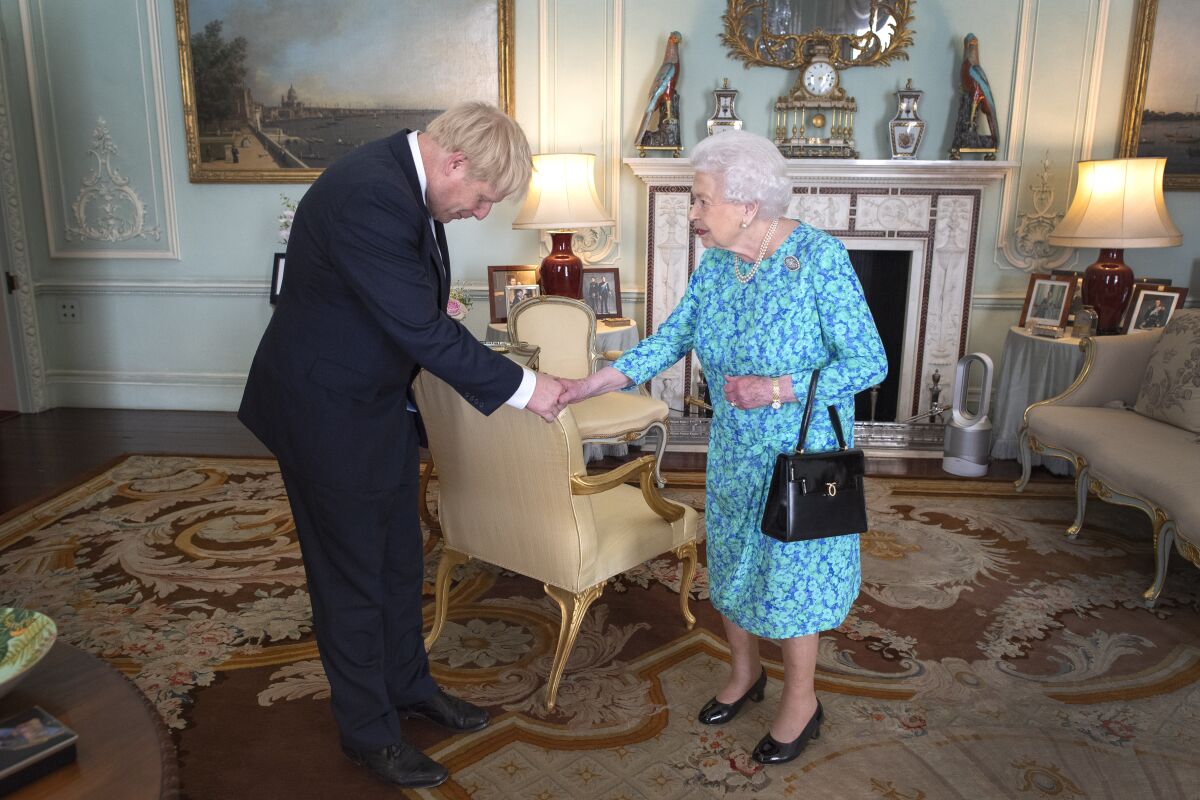 Prime Minister Boris Johnson meets with Queen Elizabeth II in July.