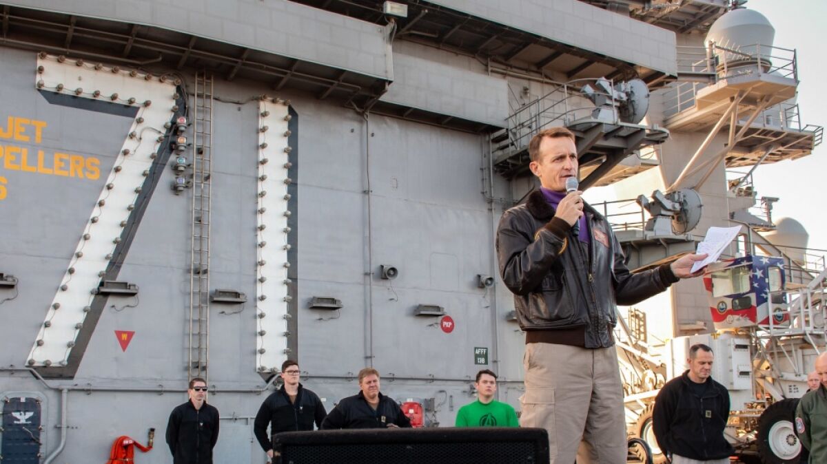 Capt. Brett Crozier, then-commanding officer of the aircraft carrier USS Theodore Roosevelt, gives remarks during an all-hands call on the ship’s flight deck Dec. 15.