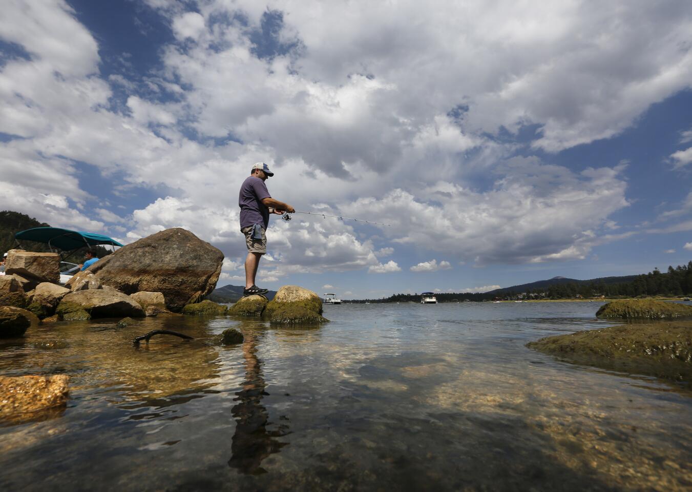 Ventura resident Robert Hirschhorn fishes along the north shore of Big Bear Lake, not knowing that it is one of 187 reservoirs formally designated by state water regulators this year as "mercury impaired."