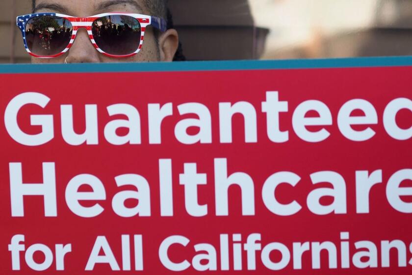 People rally in favor of single-payer healthcare for all Californians as the US Senate prepares to vote on the Senate GOP health care bill, outside the office of California Assembly Speaker Anthony Rendon, June 27, 2017 in South Gate, California. Rendon announced last week that Senate Bill SB 562 - the high-profile effort to establish a single-payer healthcare system in California - would be shelved, saying it was "incomplete." / AFP PHOTO / Robyn BeckROBYN BECK/AFP/Getty Images ** OUTS - ELSENT, FPG, CM - OUTS * NM, PH, VA if sourced by CT, LA or MoD **