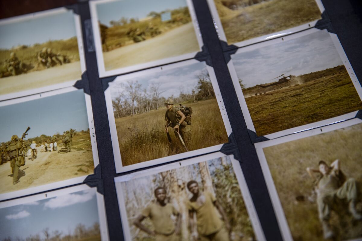 Vietnam veteran Tom Sandoval, center, took copious amounts of photos while overseas in 1970.