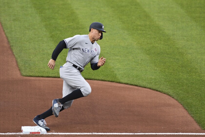 New York Yankees' Aaron Judge rounds third base on the way to scoring during the first inning against the Baltimore Orioles in a baseball game Saturday, May 15, 2021, in Baltimore. (AP Photo/Terrance Williams)
