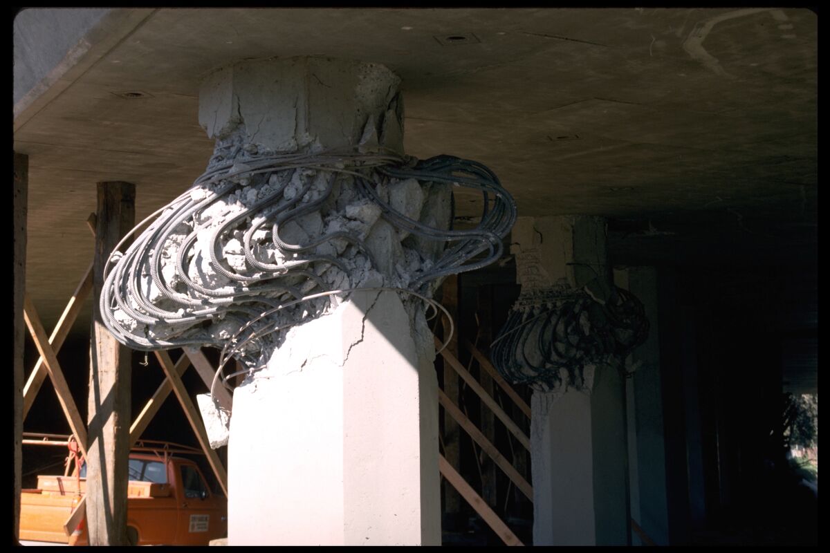 After shaken by the Northridge earthquake, concrete in this column explodes outward, coming closer to failure. 