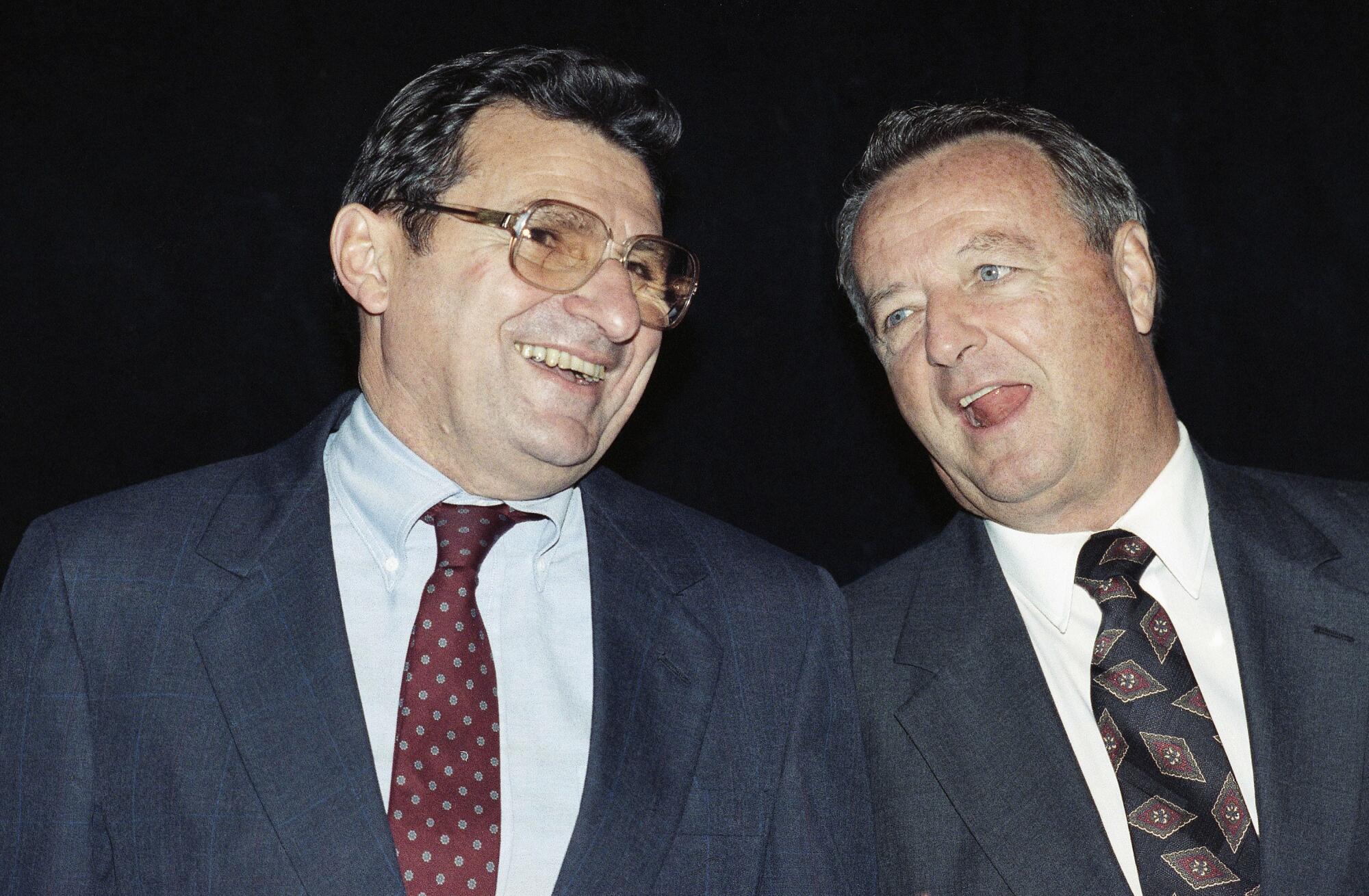 A closeup of Joe Paterno and Bobby Bowden standing together.