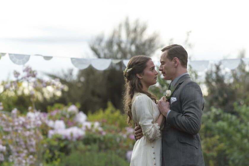 Michael Fassbender as Tom Sherbourne and Alicia Vikander as his wife, Isabel, in “The Light Between Oceans.”