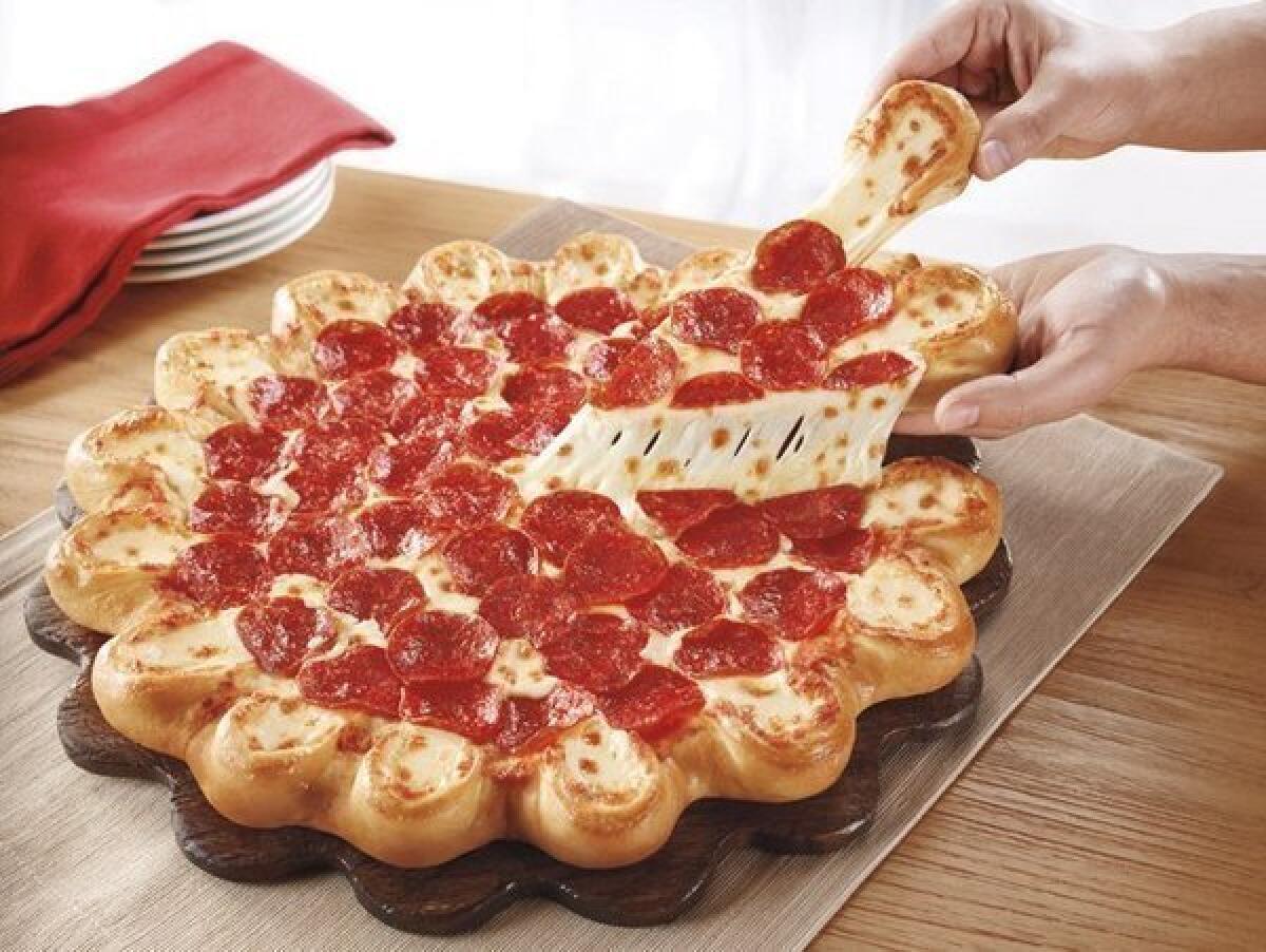 A Pizza Hut pizza. A Reddit community began an effort to send pizzas to Boston following Monday's bombing tragedy at the Boston Marathon.