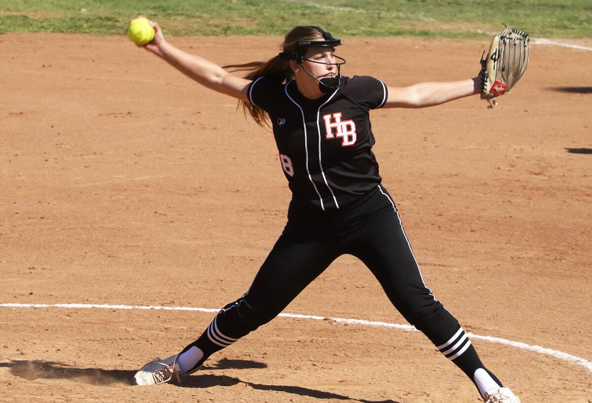 Huntington Beach's Emma Francisco (8) pitches against Los Alamitos in the Michelle Carew Classic on Saturday.