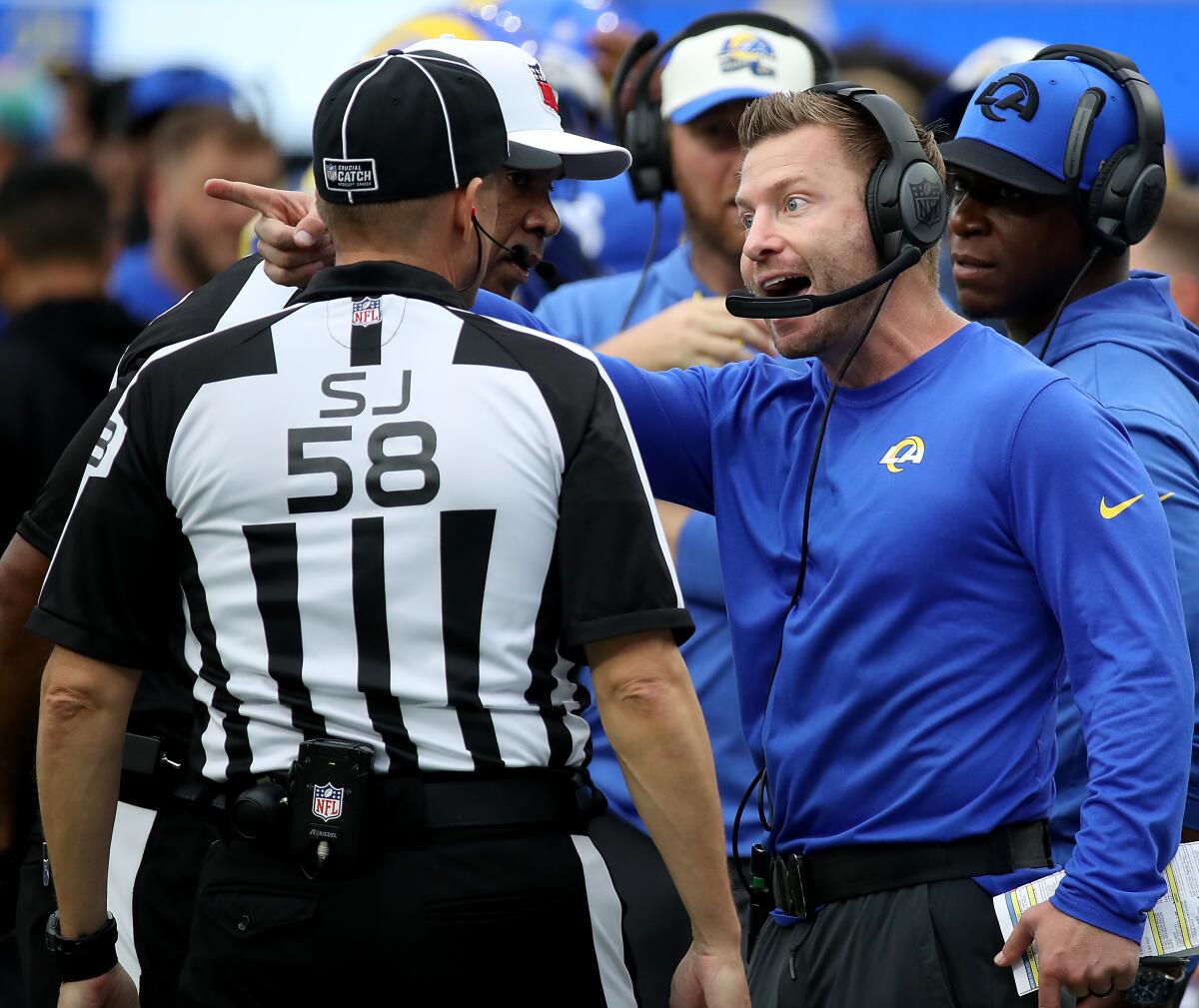 Rams head coach Sean McVay talks with an official in the third quarter quarter of an NFC game against Carolina.