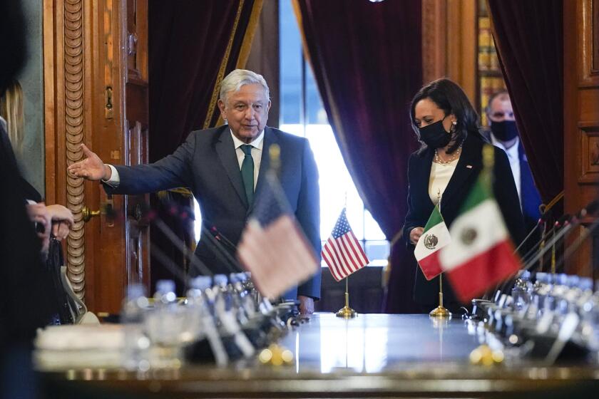 Vice President Kamala Harris and Mexican President Andres Manuel Lopez Obrador arrive for a bilateral meeting Tuesday, June 8, 2021, at the National Palace in Mexico City. (AP Photo/Jacquelyn Martin)