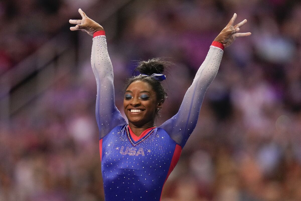 Simone Biles celebrate her performance on the vault during the women's U.S. Olympic Gymnastics Trials 
