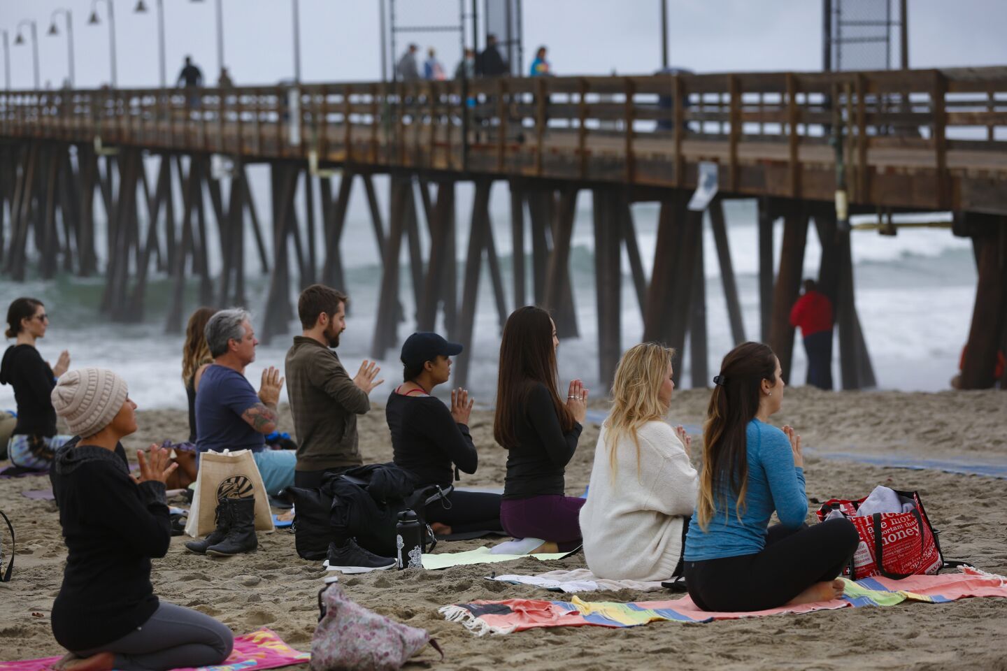 At the San Diego Yoga Festival held in Imperial Beach, several participants took part in the morning yoga session held Sunday on the sand near the Imperial Beach Pier.