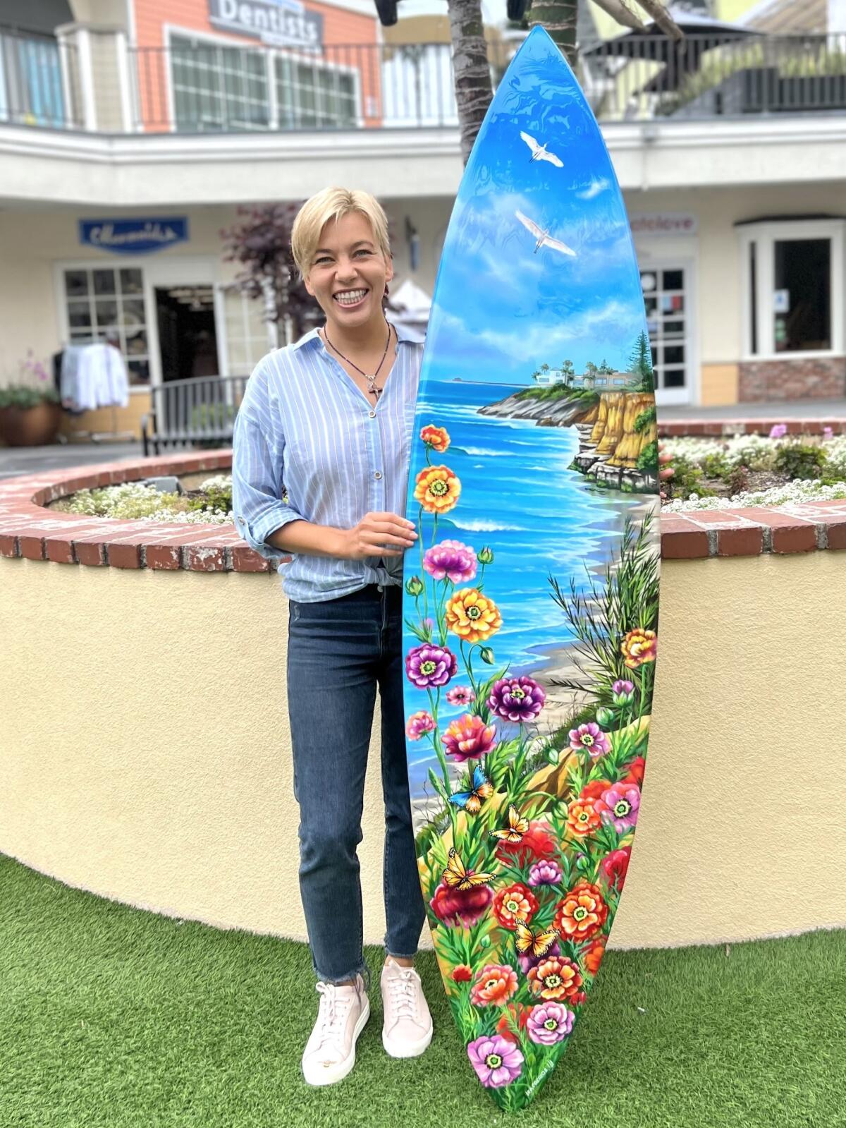 Ira Cosmos with surfboard art.