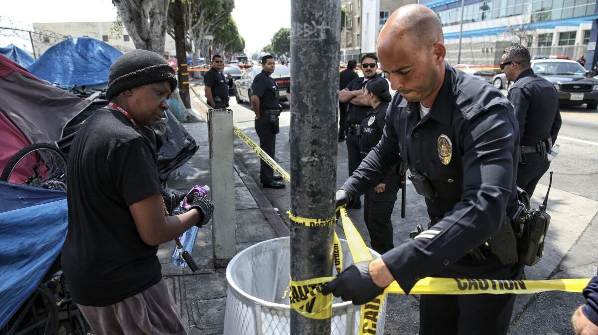 A section of skid row is barricaded after stabbings that left three people injured. Police say they saw the third attack and wounded the assailant.