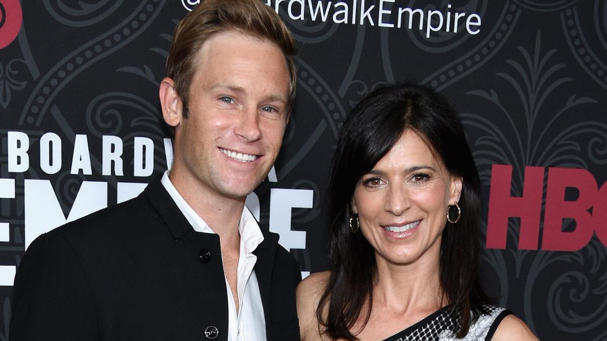 Newly engaged actress Perrey Reeves and her fiance Aaron Fox hit the "Boardwalk Empire" premiere Sept. 3 in New York.