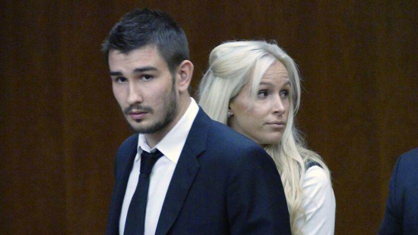 Slava Voynov enters a Torrance courtroom with his wife, Marta Varlamova, in July 2015, before pleading no contest to a misdemeanor domestic violence charge.