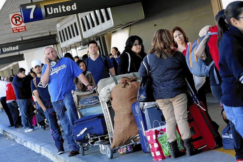 Travelers forced to pay checked-bag fees may not have noticed airlines at the same time lowering ticket fares slightly to help make the extra costs more palatable.