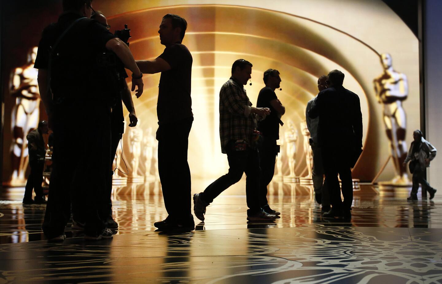 Stage managers and crew were in constant motion Saturday during rehearsals at the Dolby Theatre for Sunday's 88th annual Academy Awards.
