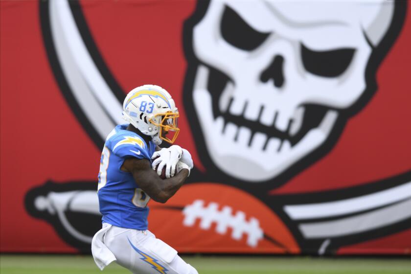 Los Angeles Chargers wide receiver Tyron Johnson (83) scores on a 53-yard touchdown reception.