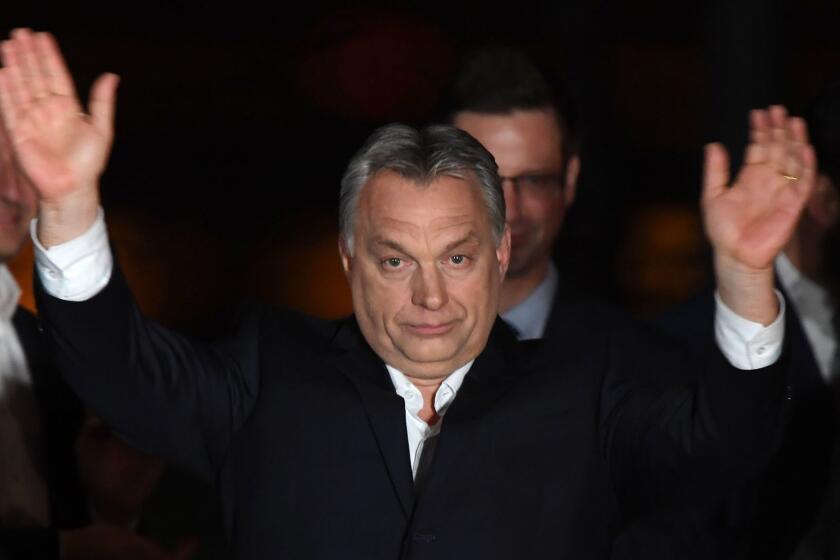 TOPSHOT - Hungarian Prime Minister Viktor Orban (C) celebrates on podium on the bank of the Danube River after winning the parliamentary election with members of his FIDESZ party on April 8, 2018 in Budapest. / AFP PHOTO / ATTILA KISBENEDEKATTILA KISBENEDEK/AFP/Getty Images ** OUTS - ELSENT, FPG, CM - OUTS * NM, PH, VA if sourced by CT, LA or MoD **