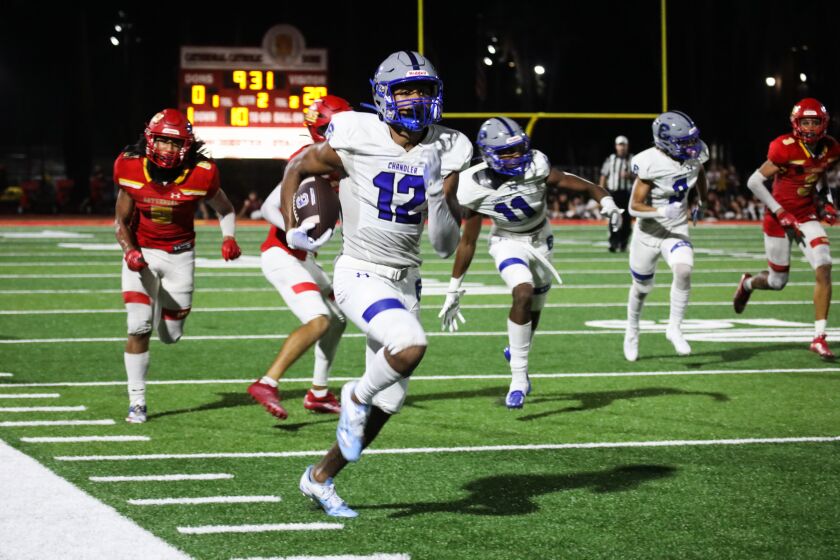 Chandler High School’s Andereya Nsubuga runs with the ball against Cathedral Catholic during the 2022 SoCal Honor Bowl in San Diego on Friday, Sept. 2, 2022.