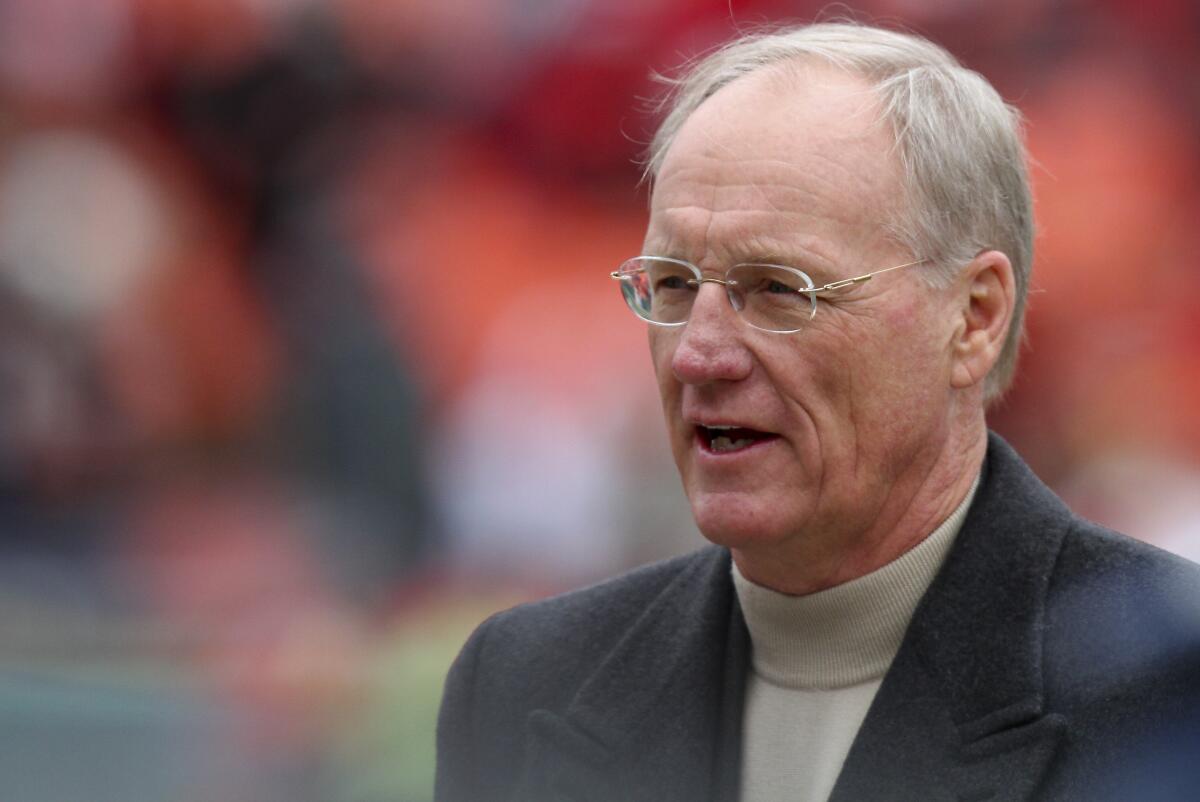 Marty Schottenheimer walks the field