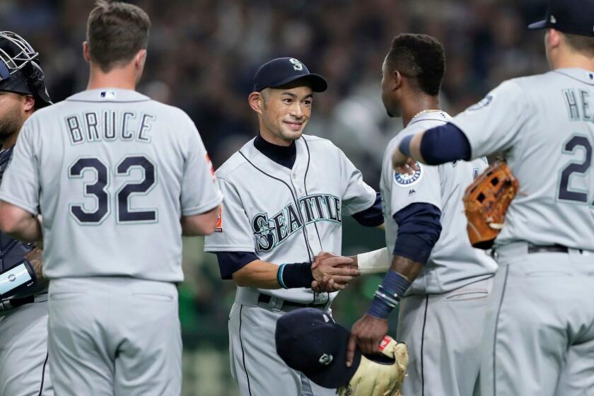 Mandatory Credit: Photo by KIYOSHI OTA/EPA-EFE/REX (10160954q) Outfielder Ichiro Suzuki (C) of the Seattle Mariners shakes hands with teammates as he leaves for replacement in the fourth inning of the first game between the Oakland Athletics and the Seattle Mariners during the Major League Baseball (MLB) Opening Games at Tokyo Dome in Tokyo, Japan, 20 March 2019. 2019 Major League Baseball Opening Series in Japan, Tokyo - 20 Mar 2019 ** Usable by LA, CT and MoD ONLY **