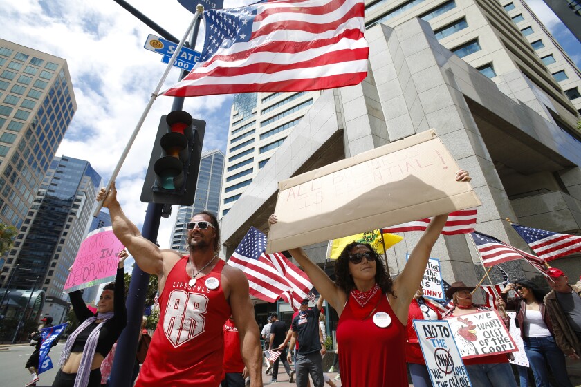 About 200 supporters held a rally in downtown San Diego on Sunday at the corner of Broadway and State Street. The group was calling on elected leaders to reopen California and allow everyone to return to work.