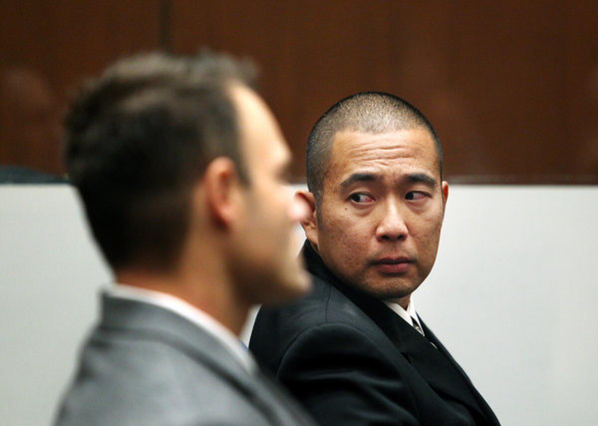 Former LAPD officers Evan Samuel, left, and Richard Amio after the verdict was read in their trial last year.