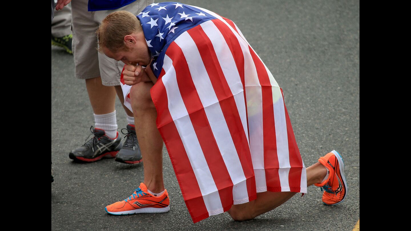 American Jared Ward pauses after finishing third in the men's elite division of the 30th Los Angeles Marathon.